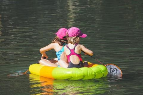 Two girls in small boat